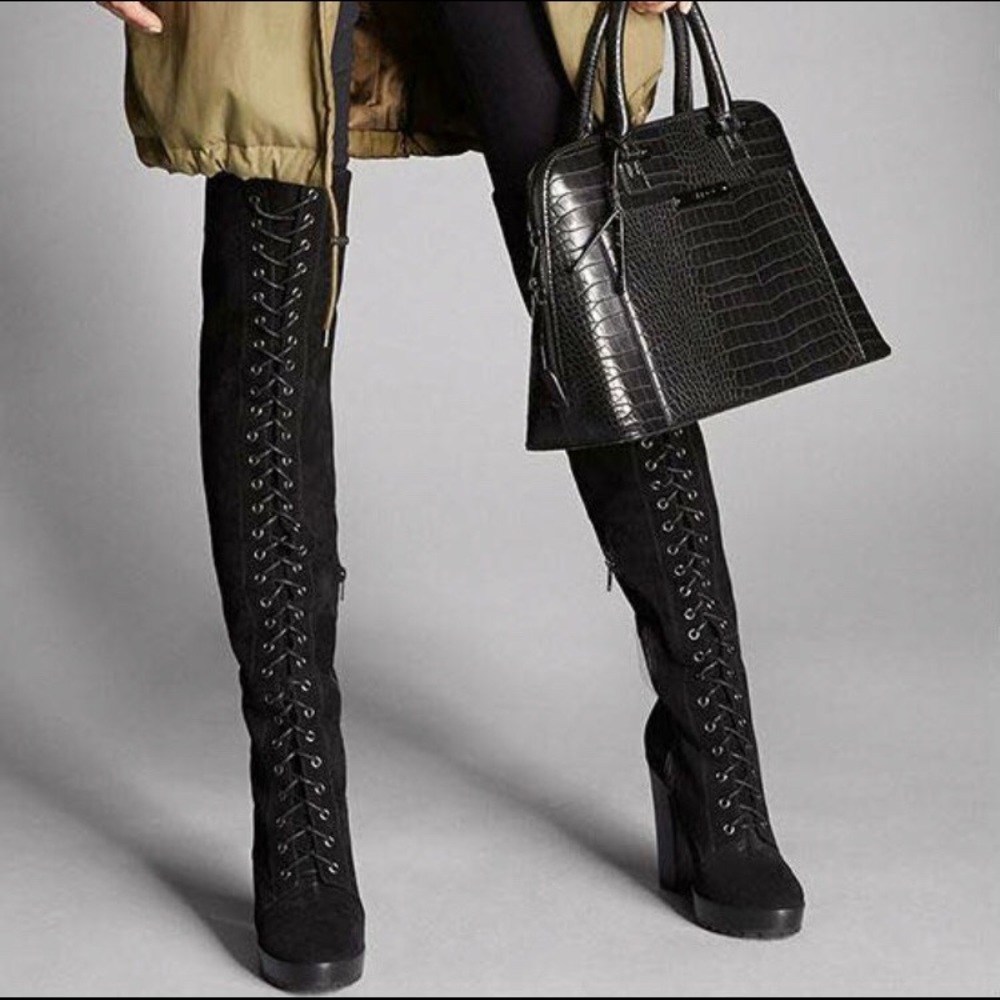 Suede thigh high lace up boots.